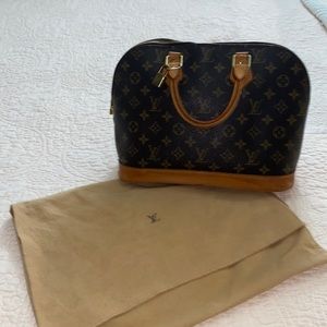 Authentic vintage Louis Vuitton.